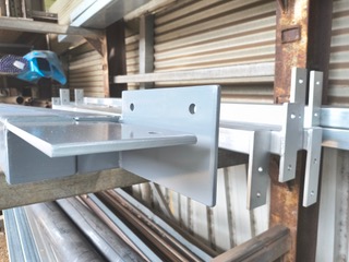 Custom-fabricated gate hardware and brackets by Marshall Steel